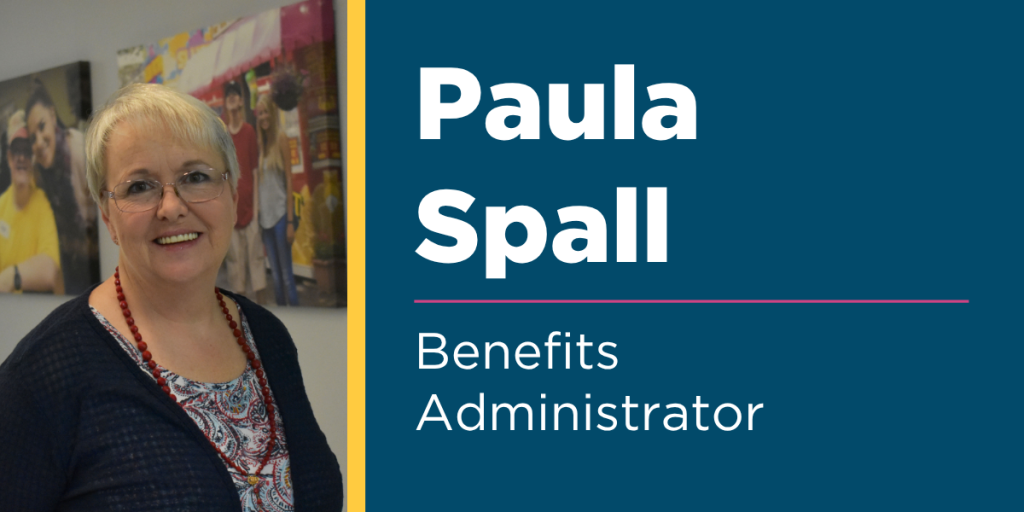 Photos of Benchmark Benefits Administrator, Paula Spall, wearing a black cardigan sweater and colorful top and smiling 